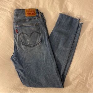 Levi’s 711 medium wash ripped skinny cutoff jeans